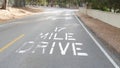 Scenic 17-mile drive, Monterey, California coast. Sign on asphalt, road marking. Royalty Free Stock Photo