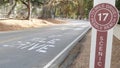 Scenic 17-mile drive, Monterey, California coast. Sign on asphalt, road marking. Royalty Free Stock Photo