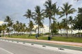 Scenic morning view of the Ocean Drive tourist district road with palm trees in South Beach.