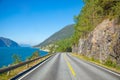 Scenic mountain road next to fjord in summer day, Norway Royalty Free Stock Photo