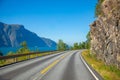 Scenic mountain road next to fjord in summer day, Norway Royalty Free Stock Photo