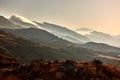 Scenic mountainscape at sunset, a panoramic shot of green woodland