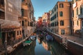 Scenic Narrow Canal in Venice, Italy with Traditional Architecture and Gondolas
