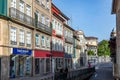 scenic narrow street in Chaves in early morning light with cobble stones and old historic houses