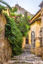 Scenic narrow street with old houses in Plaka district, Athens, Greece