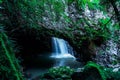 Scenic natural bridge circuit, arch in Springbrook national park  and stones covered in moss Royalty Free Stock Photo