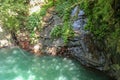 Scenic nature of beautiful and emerald pool of fresh water lake. Beautiful place, trees, rocks and a mountain lake. Royalty Free Stock Photo