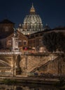 Scenic night cityscape of Rome with the illuminated cupola of St Peter Basilica, Italy.