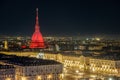 Scenic night cityscape of Turin with the Mole Antonelliana and Vittiorio square lighted in red in Christmas time, Italy