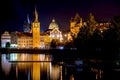 Scenic night view of Charles Bridge and buildings along the Vltava river. Prague, Czech Republic Royalty Free Stock Photo