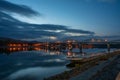 Scenic nightscape of Maria Valeria bridge with reflection in Danube river, Esztergom, Hungary at early morning