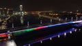 Scenic nighttime view of Belgrade Branko bridge over water, with cars seen driving across
