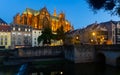 Metz cityscape at nigh with illuminated Cathedral on bank of Moselle River