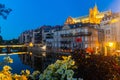 Metz cityscape at nigh with illuminated Cathedral on bank of Moselle River