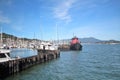 Ocean and mountain views along a boat harbor in Sausalito, California