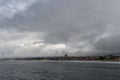 Scenic Oceanside vista viewed from the pier on a rainy winter day Royalty Free Stock Photo