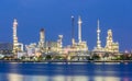 Scenic of oil refinery plant of Petrochemistry industry in twilight time and reflection in near river. Royalty Free Stock Photo