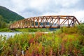 Scenic old wooden bridge in fall Northern nature