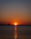 Scenic orange sunset in a clear sky over a seascape at Charleston harbor Royalty Free Stock Photo