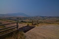 Scenic overlook in Montana with a cattle gate and mountain background