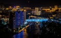 Scenic panorama of Sanya city illuminated at night with Sanya river bridge and modern buildings in Sanya Hainan island China Royalty Free Stock Photo