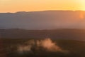 Scenic panorama of the Tuscan landscape with hills and harvest fields in golden morning light, Val d'Orcia, Italy. Royalty Free Stock Photo