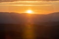 Scenic panorama of the Tuscan landscape with hills and harvest fields in golden morning light, Val d'Orcia, Italy. Royalty Free Stock Photo