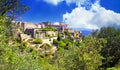 Scenic panoramic view on medieval picturesque old french village on hill top, blue summer sky, fluffy clouds - Gordes, Provence, Royalty Free Stock Photo