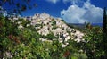 Scenic panoramic view on medieval picturesque old french village on hill top, blue summer sky, fluffy clouds - Gordes, Provence, Royalty Free Stock Photo