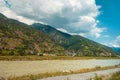 Scenic panoramic view of mountains landscape with small hillside houses, Switzerland. Royalty Free Stock Photo