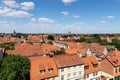 Scenic panoramic view traditional shingle tiled red rooftop old ancient medieval european german small town Quedlinburg