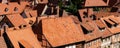 Scenic panoramic view traditional shingle tiled red rooftop old ancient medieval european german small town Quedlinburg Royalty Free Stock Photo