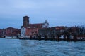 Scenic panoramic view of Venice in winter. Moored boats near colorful ancient buildings. Winter drizzle morning in Venice Royalty Free Stock Photo