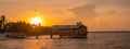 Scenic panoramic view of a wooden pier at the Key West island in Florida during a mesmerizing sunset Royalty Free Stock Photo