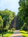 Scenic park with a unique incline and tree-lined pathway in daylight Royalty Free Stock Photo