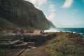 Scenic pathway leading down to a sweeping beach and picturesque hillside dotted with charming houses