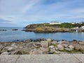 Scenic pathway paved with stones leading to a picturesque building near the shoreline