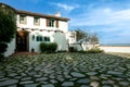 Scenic pathway of stones winding up to the Adamson House on a sunny day, Malibu