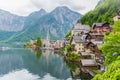 Scenic picture-postcard view of famous Hallstatt mountain village in the Austrian Alps with passenger ship in beautiful morning l Royalty Free Stock Photo