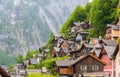 Scenic picture-postcard view of famous Hallstatt mountain village in the Austrian Alps with passenger ship in beautiful morning l