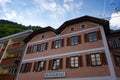 Hallstatt, Austria - May 21, 2017: Scenic picture-postcard view of traditional old wooden houses in famous Hallstatt mountain vill Royalty Free Stock Photo