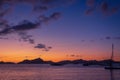 Scenic purple sunset over sea in Philippines, Palawan. Island and boats silhouettes in evening dusk. Calm golden evening in Asia. Royalty Free Stock Photo