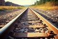 Scenic railroad track in sunlight, ballast gravel, and crushed stone