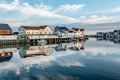 scenic reflection of typical wooden houses in the harbor of Svolvaer,Norway Royalty Free Stock Photo