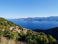 Scenic road D81 winding up to Calanche de Piana, UNESCO world heritage. Aerial view of Gulf of Porto. Corsica, France. Royalty Free Stock Photo
