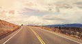 Scenic road in Grand Teton National Park, color toning applied, Wyoming, USA Royalty Free Stock Photo