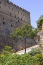 The scenic road among the rocks on the Vomero Hill leading to medieval Castel Sant`Elmo, Naples, Italy Royalty Free Stock Photo