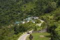 Scenic road to Auli with houses and mountain backdrop. Chamoli district Uttarakhand, India