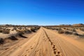 scenic road trip through a desert landscape, with endless sand dunes and clear blue skies Royalty Free Stock Photo