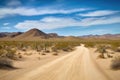scenic road trip through the desert with sand dunes and cacti in the background Royalty Free Stock Photo